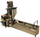 side angle view of the Lil' Orbits SS1200 automatic donut frying machine on a white background, showing the automatic hopper that dispenses the batter into the frying area, where the donut travels down the frying chamber and is automatically flipped and then dispensed when done